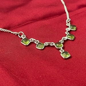 Silver necklace with faux green jewels